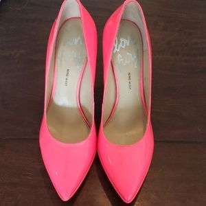 Neon pink pumps